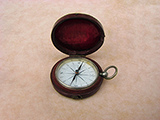 Early Victorian pocket compass in leather covered outer case.